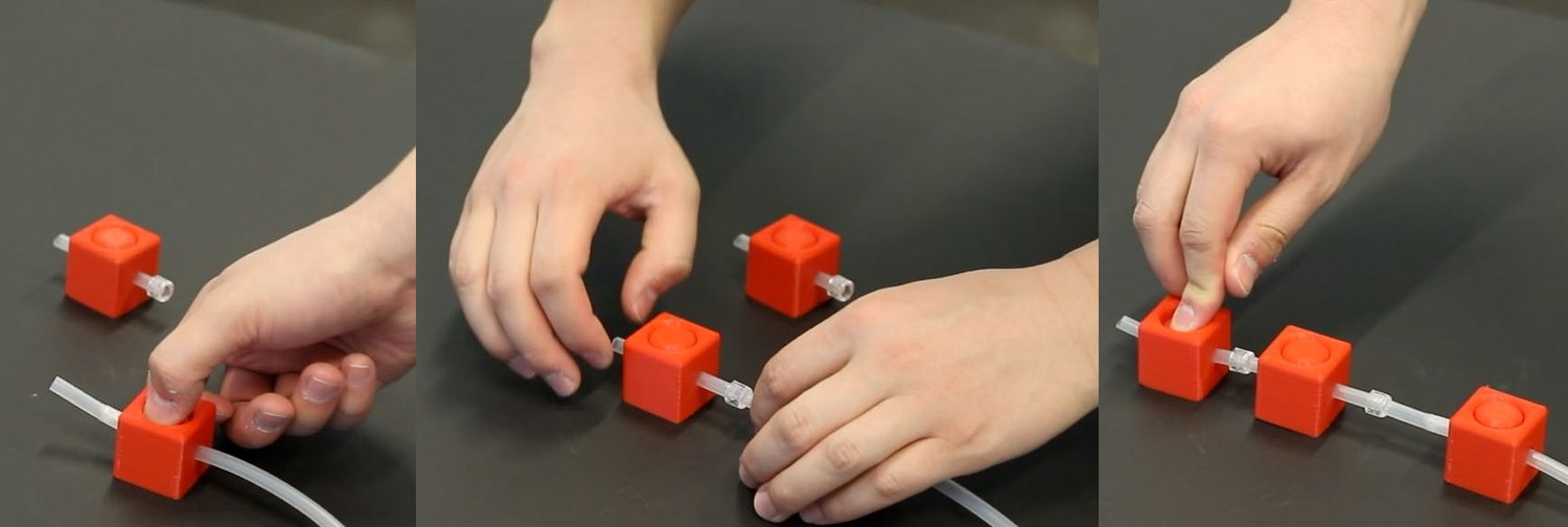Three-panel image showing hands assembling red cubes with tubes. The sequence
depicts connecting cubes, showcasing the modularity of the
tool.
